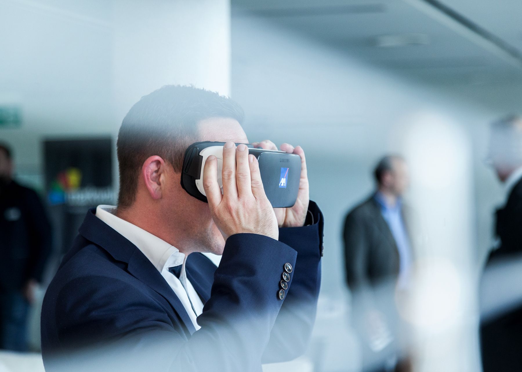 business man holding digital goggles, blue surrounding